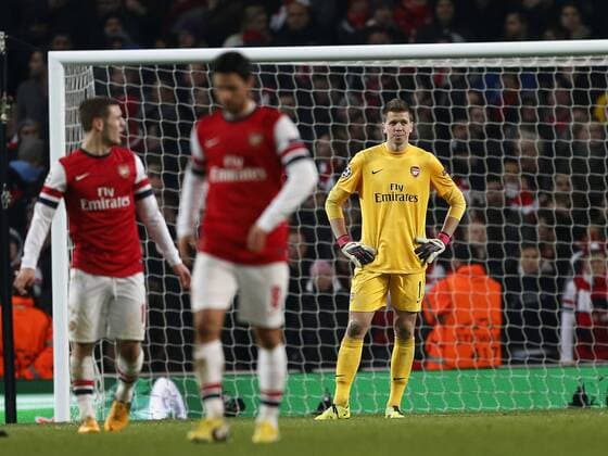 Arsenal s Wojciech Szczesny looks on dejected after Munich s third goal..Arsenal v Bayern Munich - Champions League Second Round, First Leg- Emirates Stadium, London- 19 02 13 - Picture David Klein Sportimage EDITORIAL USE ONLY. No use with unauthorised audio, video, data, fixture lists, club league logos or live services. Online in-match use limited to 120 images, no video emulation. No use in betting, games or single club league player publications.