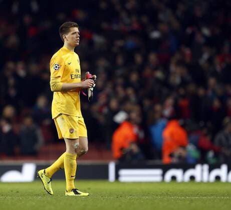 Arsenal s Wojciech Szczesny looks on dejected at the final whistle..Arsenal v Bayern Munich - Champions League Second Round, First Leg- Emirates Stadium, London- 19 02 13 - Picture David Klein Sportimage EDITORIAL USE ONLY. No use with unauthorised audio, video, data, fixture lists, club league logos or live services. Online in-match use limited to 120 images, no video emulation. No use in betting, games or single club league player publications.