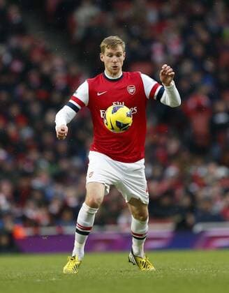 Arsenal FC London s Per Mertesacker in action..Arsenal FC London v Aston Villa - Premier League - Emirates Stadium, London- 23 02 13 - EDITORIAL USE ONLY. No use with unauthorised audio, video, data, fixture lists, club league logos or live services. Online in-match use limited to 120 images, no video emulation. No use in betting, games or single club league player publications.