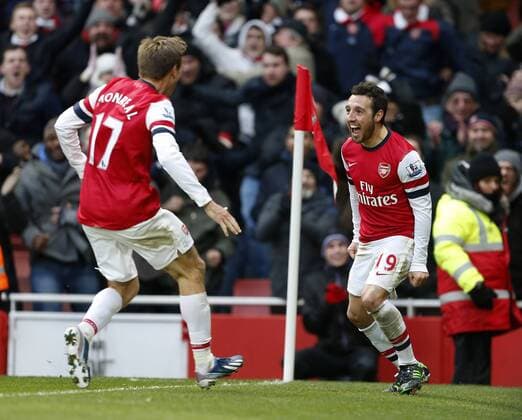 Arsenal FC London s Santi Cazorla celebrates scoring his second goal..Arsenal FC London v Aston Villa - Premier League - Emirates Stadium, London- 23 02 13 - EDITORIAL USE ONLY. No use with unauthorised audio, video, data, fixture lists, club league logos or live services. Online in-match use limited to 120 images, no video emulation. No use in betting, games or single club league player publications.