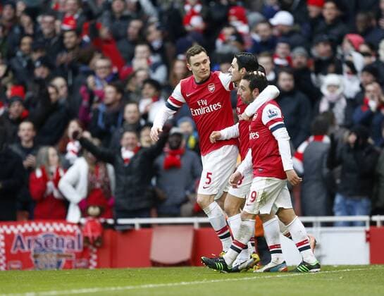 Arsenal FC London s Santi Cazorla celebrates scoring his second goal with Thomas Vermaelen..Arsenal FC London v Aston Villa - Premier League - Emirates Stadium, London- 23 02 13 - EDITORIAL USE ONLY. No use with unauthorised audio, video, data, fixture lists, club league logos or live services. Online in-match use limited to 120 images, no video emulation. No use in betting, games or single club league player publications.