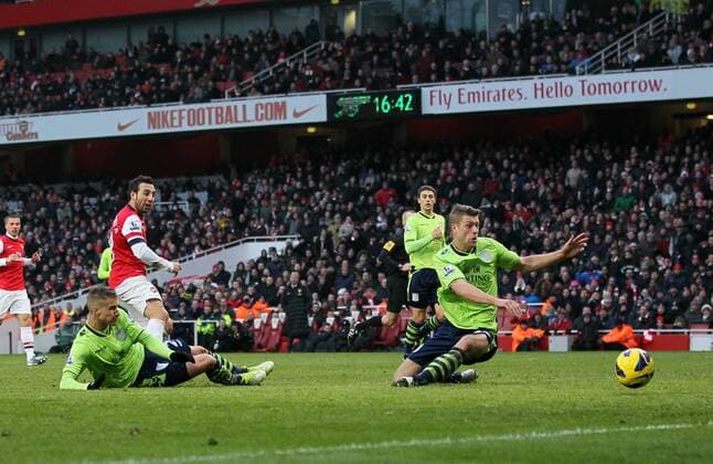 Arsenal FC London s Santi Cazorla scoring his second goal..Arsenal FC London v Aston Villa - Premier League - Emirates Stadium, London- 23 02 13 - EDITORIAL USE ONLY. No use with unauthorised audio, video, data, fixture lists, club league logos or live services. Online in-match use limited to 120 images, no video emulation. No use in betting, games or single club league player publications.