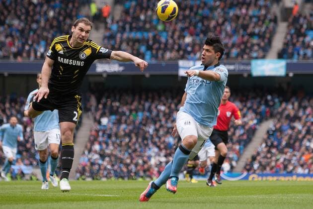 Football - 2012 2013 Premier League - Manchester City vs. Chelsea Sergio Kun Aguero of Manchester City gets in behind Branislav Ivanovic of Chelsea at the Etihad Stadium 