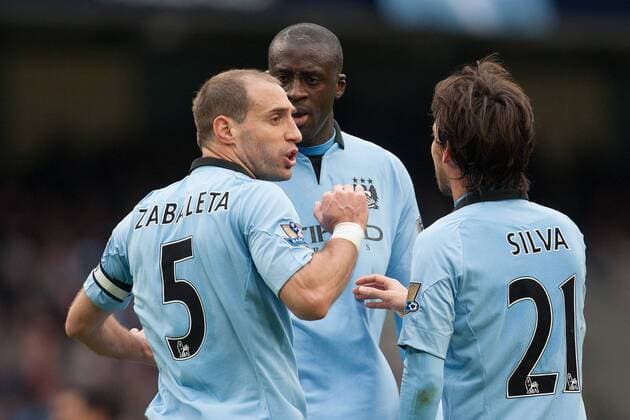 Football - 2012 2013 Premier League - Manchester City vs. Chelsea FC London - Pablo Zabaleta and Yaya Toure of Manchester City have a disagreement at the Etihad Stadium 
