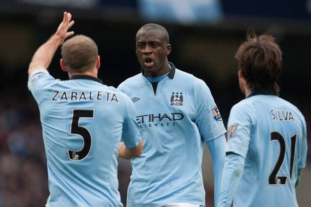 Football - 2012 2013 Premier League - Manchester City vs. Chelsea FC London - Pablo Zabaleta and Yaya Toure of Manchester City have a disagreement at the Etihad Stadium 