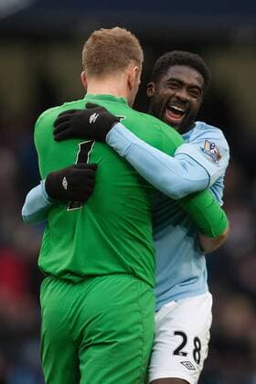 Football - 2012 2013 Premier League - Manchester City vs. Chelsea FC London - Kolo Toure and Joe Hart of Manchester City celebrate victory at the Etihad Stadium 
