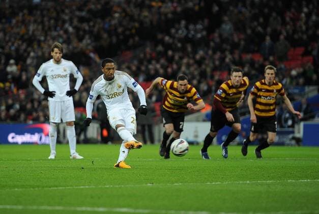 Football - 2013 Capital One League Cup Final - Bradford City vs. Swansea City Jonathan de Guzman of Swansea City scores from the penalty spot at Wembley Stadium, London 