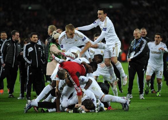 Football - 2013 Capital One League Cup Final - Bradford City vs. Swansea City The Swansea City players celebrate their win at Wembley Stadium, London 