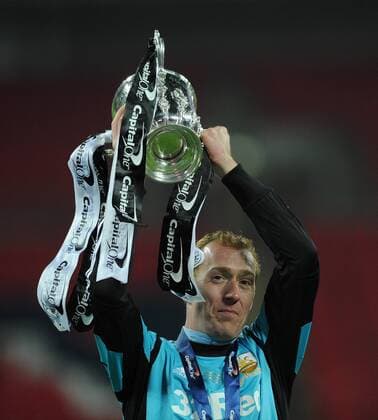 Football - 2013 Capital One Cup Final - Bradford City vs. Swansea City Gerhard Tremmel of Swansea City celebrates with the cup following his teams win at Wembley Stadium, London 