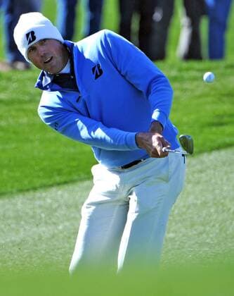 Matt Kuchar chips onto the thirteenth green on his way to winning the Accenture World Golf Championship at The Golf Club at Dove Mountain in Marana, Arizona February 24, 2013.  PXP2013022413