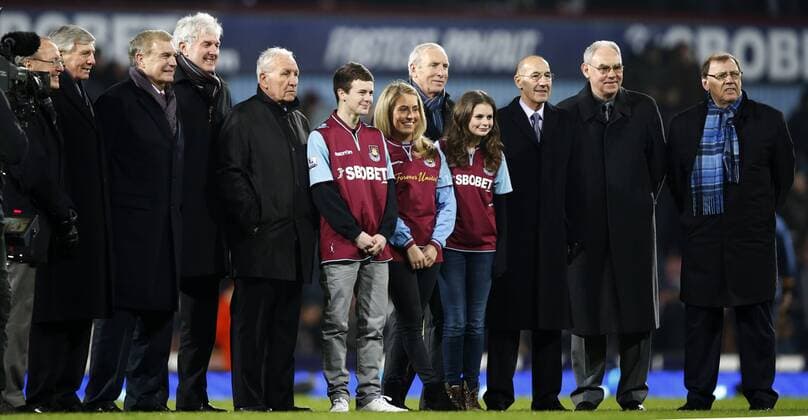 Bobby Moore s grandchildren (middle in the uniform, from L to R) Freddie, Ava, and Poppy pose for photo with guests during the half time of the Barclays Premier League match between West Ham United and Tottenham Hotspur at the Boleyn Ground, Upton Park, in London, Britain on February 25, 2013.Tottenham Hotspur won 3-2 and lift into third in the table. (Xinhua Wang Lili) LONDON-SOCCER-PREMIER LEAGUE-TOTTENHAM HOTSPUR VS WEST HAM UTD 