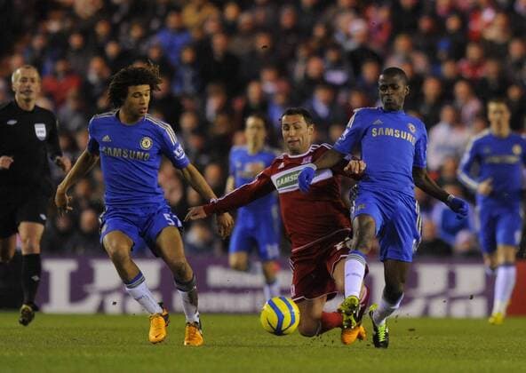 Scott McDonald of Middlesbrough (C) is brought down by Ramires of Chelsea (R) - The FA Cup with Budweiser - Middlesbrough vs Chelsea - Riverside Stadium - Middlesbrough - 27 02 13 - Picture Richard Lee Sportimage EDITORIAL USE ONLY. No use with unauthorised audio, video, data, fixture lists, club league logos or live services. Online in-match use limited to 120 images, no video emulation. No use in betting, games or single club league player publications.