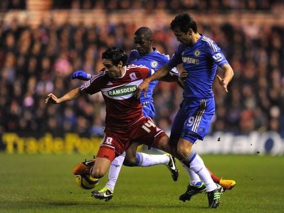 Rhys Williams of Middlesbrough (C) is foulded by Paulo Ferreira of Chelsea (R) - The FA Cup with Budweiser - Middlesbrough vs Chelsea - Riverside Stadium - Middlesbrough - 27 02 13 - Picture Richard Lee Sportimage EDITORIAL USE ONLY. No use with unauthorised audio, video, data, fixture lists, club league logos or live services. Online in-match use limited to 120 images, no video emulation. No use in betting, games or single club league player publications.