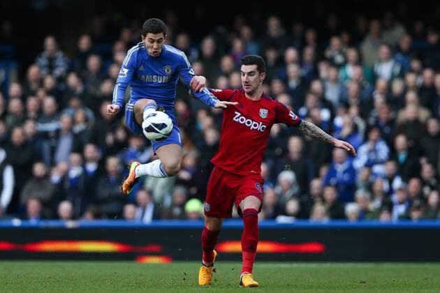 Football - 2012 2013 Premier League - Chelsea FC London vs. West Bromwich Albion - Eden Hazard of Chelsea and Liam Ridgewell of West Bromwich Albion at Stamford Bridge, London 
