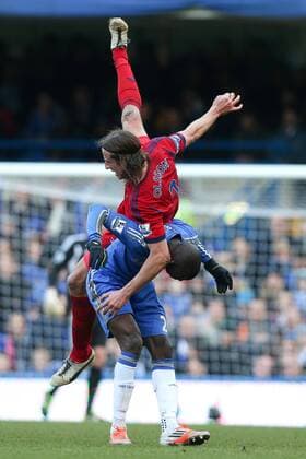 Football - 2012 2013 Premier League - Chelsea FC London vs. West Bromwich Albion - Jonas Olsson of West Bromwich Albion goes over the back of Demba Ba of Chelsea at Stamford Bridge, London 