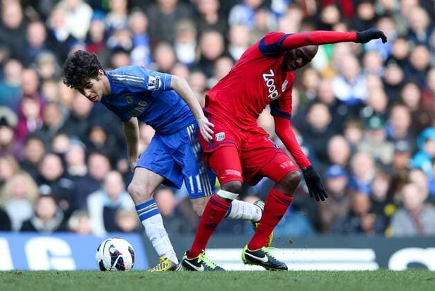 Football - 2012 2013 Premier League - Chelsea FC London vs. West Bromwich Albion - Oscar of Chelsea and Youssouf Mulumbu of West Bromwich Albion at Stamford Bridge, London 