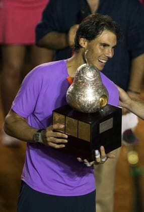 Spain s Rafael Nadal poses with his trophy after the men s singles final match at the Mexican Open Tennis Tournament held in Acapulco, State of Guerrero, Mexico, on Mar. 2, 2013. (Xinhua Bao Feifei) MEXICO-ACAPULCO-TENNIS-OPEN 