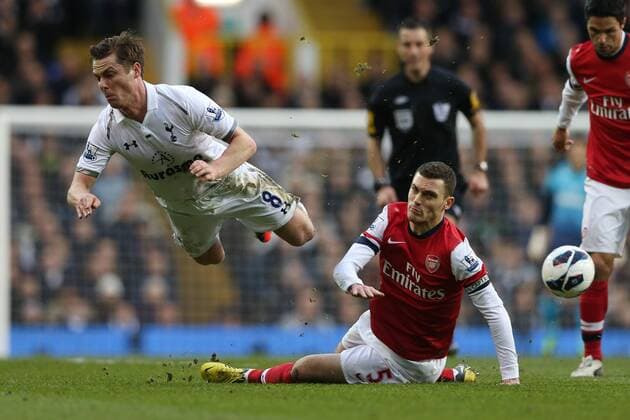 Football - 2012 2013 Premier League -Tottenham Hotspur vs Arsenal Tottenham s Scott Parker is fouled by Thomas Vermaelen of Arsenal at White Hart Lane, London 