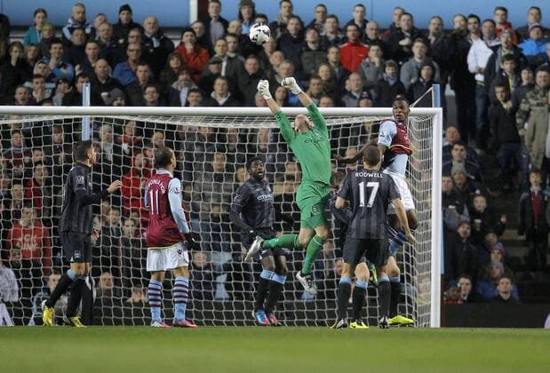 Manchester City goalkeeper Joe Hart flaps at a cross -Football - Aston Villa vs Manchester City - Barclays Premier League Season 12 13 - 4 3 2013 - Villa Park - Birmingham.Picture Malcolm Couzens Sportimage EDITORIAL USE ONLY. No use with unauthorised audio, video, data, fixture lists, club league logos or live services. Online in-match use limited to 120 images, no video emulation. No use in betting, games or single club league player publications.