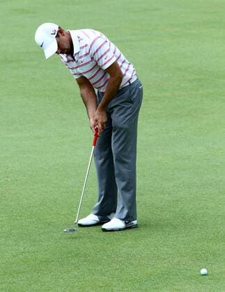21.03.2013 Kuala Lumpur, Malaysia. Charl Schwartzel of South Africa make a birie putts on the 9th hole during day one of the the Maybank Malaysia Open Golf Tournament at the Kuala Lumpur Golf and Country Club. xMegatxFirdausx  ActionPlus11389253