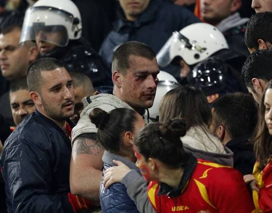 Montenegro s fans fight amongst themselves before kick-off - World Cup Qualifier - Podgorica City Stadium, Podgorica- 26 03 13 - DavidxKlein Sportimage EDITORIAL USE ONLY. No use with unauthorised audio, video, data, fixture lists, club league logos or live services. Online in-match use limited to 120 images, no video emulation. No use in betting, games or single club league player publications.