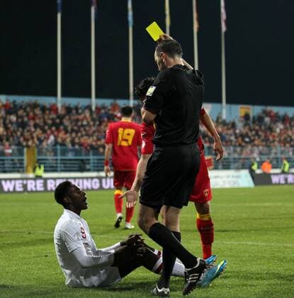 England s Danny Welbeck gets booked for diving..Montenegro v England- World Cup Qualifier - Podgorica City Stadium, Podgorica- 26 03 13 - Picture David Klein Sportimage EDITORIAL USE ONLY. No use with unauthorised audio, video, data, fixture lists, club league logos or live services. Online in-match use limited to 120 images, no video emulation. No use in betting, games or single club league player publications.