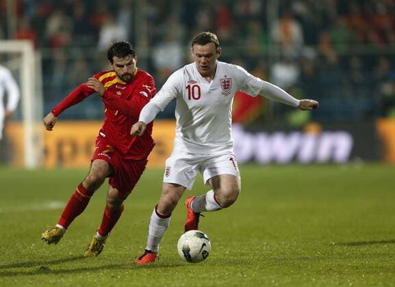 England s Wayne Rooney in action..Montenegro v England- World Cup Qualifier - Podgorica City Stadium, Podgorica- 26 03 13 - Picture David Klein Sportimage EDITORIAL USE ONLY. No use with unauthorised audio, video, data, fixture lists, club league logos or live services. Online in-match use limited to 120 images, no video emulation. No use in betting, games or single club league player publications.