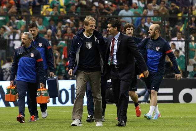 26 March 2013: U.S. head coach Jurgen Klinsmann (GER) (left) and Mexico head coach Jose Manuel (Chepo) de la Torre (MEX) (right) chat as they walk to the benches before the game. The Mexico Men s National Team played the United States Men s National Team at Estadio Azteca in Mexico City, Mexico in a CONCACAF World Cup Qualifying Final Round match for the 2014 FIFA World Cup. The game ended in a 1-1 tie. SOCCER: MAR 26 United States at Mexico Icon918130326059 EDITORIAL USE ONLY