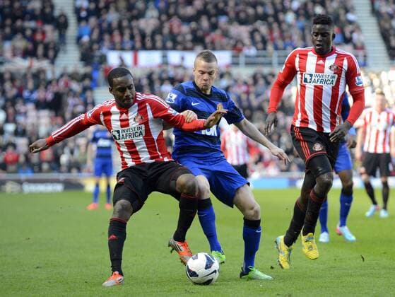 Danny Rose of Sunderland (L) is challenged by Tom Cleverley of Manchester United - Barclays Premier League - Sunderland AFC (FC) - Manchester United (ManU) - Stadium of Light - Sunderland - 30 03 13 - PictureRichardLee Sportimage EDITORIAL USE ONLY. No use with unauthorised audio, video, data, fixture lists, club league logos or live services. Online in-match use limited to 120 images, no video emulation. No use in betting, games or single club league player publications.