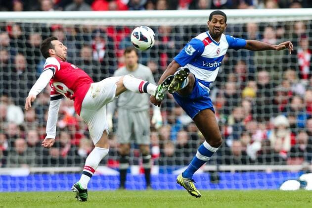 Football - 2012 2013 Premier League - Arsenal FC London - Reading FC; Reading s Mikele Leigertwood and Santi Cazorla of Arsenal at the Emirates Stadium 