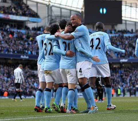 Manchester City s David SIlva celebrates scoring his sides second goal with Vincent Kompany..Manchester City v Newcastle United- Barclays Premier League - City Of Manchester Stadium, Manchester- 30 03 13 - Picture David Klein Sportimage EDITORIAL USE ONLY. No use with unauthorised audio, video, data, fixture lists, club league logos or live services. Online in-match use limited to 120 images, no video emulation. No use in betting, games or single club league player publications.