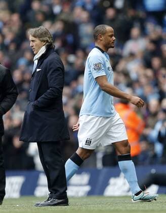 Manchester City s Vincent Kompany gets substituted as Roberto Mancini looks on dejected..Manchester City v Newcastle United- Barclays Premier League - City Of Manchester Stadium, Manchester- 30 03 13 - Picture David Klein Sportimage EDITORIAL USE ONLY. No use with unauthorised audio, video, data, fixture lists, club league logos or live services. Online in-match use limited to 120 images, no video emulation. No use in betting, games or single club league player publications.