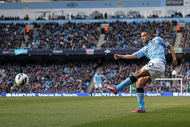 Manchester City s Gael Clichy fires in a shot..Manchester City v Newcastle United- Barclays Premier League - City Of Manchester Stadium, Manchester- 30 03 13 - Picture David Klein Sportimage EDITORIAL USE ONLY. No use with unauthorised audio, video, data, fixture lists, club league logos or live services. Online in-match use limited to 120 images, no video emulation. No use in betting, games or single club league player publications.