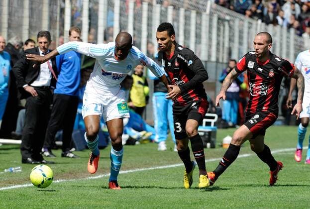 Rod Fanni (OM) - Thimothee Kolodziejczak - Didier Digard ( NICE ) FOOTBALL : OGC Nice vs Olympique de Marseille . - Ligue 1 - 31 03 2013 OlivierAnrigo Panoramic 