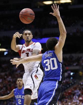 March 31, 2013 - Indianapolis, IN, USA - Louisville guard Peyton Siva (3) passes around Duke guard Seth Curry (30) in second half action in the NCAA College League USA regional final game on Sunday, March 31, 2013, in Indianapolis, Indiana. Louisville won the game 85-63. (Sam Riche MCT)in the NCAA College League USA regional final game on Sunday, March 31, 2013, in Indianapolis, Indiana. Louisville won the game 85-63. Louisville VS. Duke - ZUMAm67