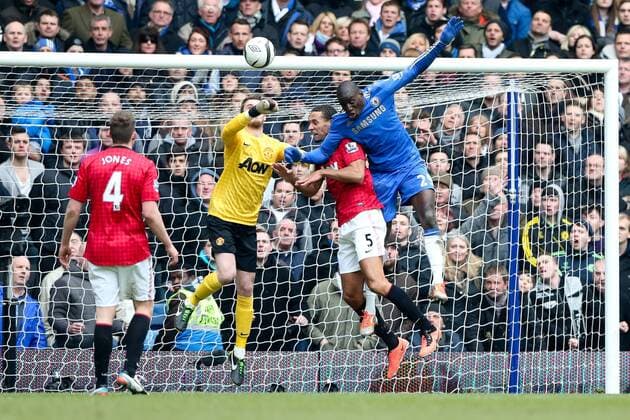 Demba Ba of Chelsea goes up for a header. but the ball is punched away by Manchester United keeper, David De Gea - Chelsea vs Manchester Utd - FA Cup Quarter-Final replay - Stamford Bridge Stadium - London - 1st April 2013 - Pic Charlie Forgham-Bailey Sportimage EDITORIAL USE ONLY. No use with unauthorised audio, video, data, fixture lists, club league logos or live services. Online in-match use limited to 120 images, no video emulation. No use in betting, games or single club league player publications.