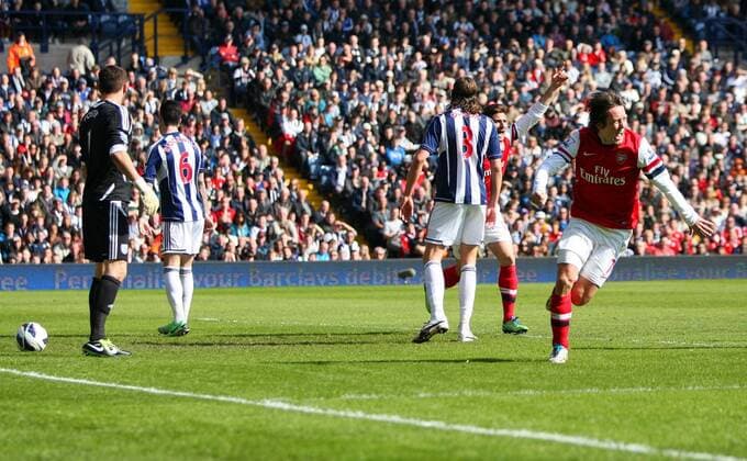 Thomas Rosicky wheels away after putting Arsenal into the lead- Barclays Premier League - West Bromwich Albion vs Arsenal FC - The Hawthorns Stadium -West Bromwich - 6th April 2013 - Credit Paul Bradbury Sportimage EDITORIAL USE ONLY. No use with unauthorised audio, video, data, fixture lists, club league logos or live services. Online in-match use limited to 120 images, no video emulation. No use in betting, games or single club league player publications.