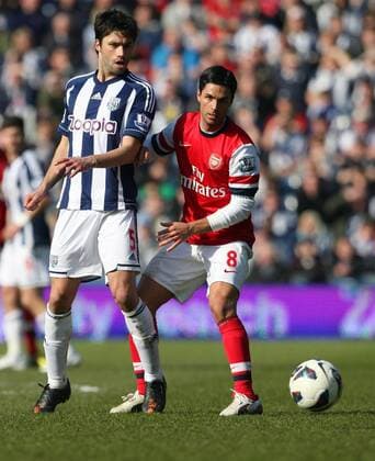 West Brom Claudio Yacob holds off Arsenal s Mikel Arteta- Barclays Premier League - West Bromwich Albion vs Arsenal - The Hawthorns Stadium -West Bromwich - 6th April 2013 - Credit Paul Bradbury Sportimage EDITORIAL USE ONLY. No use with unauthorised audio, video, data, fixture lists, club league logos or live services. Online in-match use limited to 120 images, no video emulation. No use in betting, games or single club league player publications.