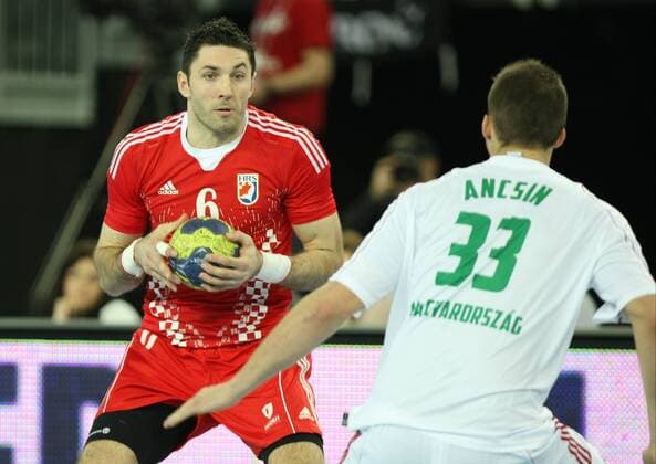 Zagreb, 6.4.2013 - Arena Zagreb hall. 2014 Men s European Championship Qualification 2 Croatia (red) - Hungary (white) 30:26. LACKOVIC Blazenko (CRO 6) vs ANCSIN Gabor (HUN 33) Croatia - Hungary 30:26