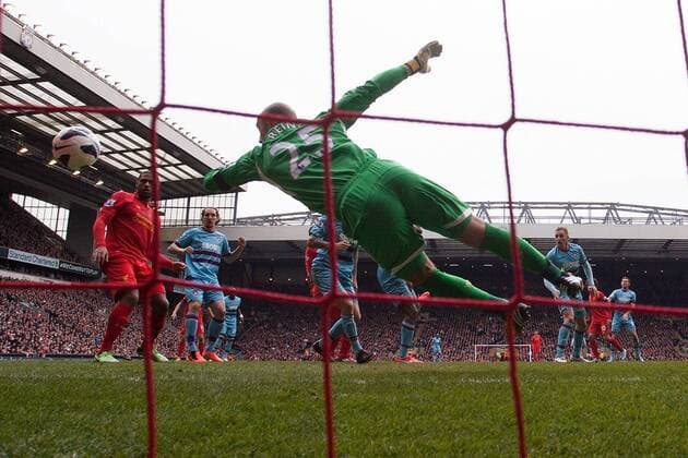 Football - 2012 2013 Premier League. Liverpool FC - West Ham United, West Ham s Jack Collison heads at goal but has it cleared off the line at Anfield 