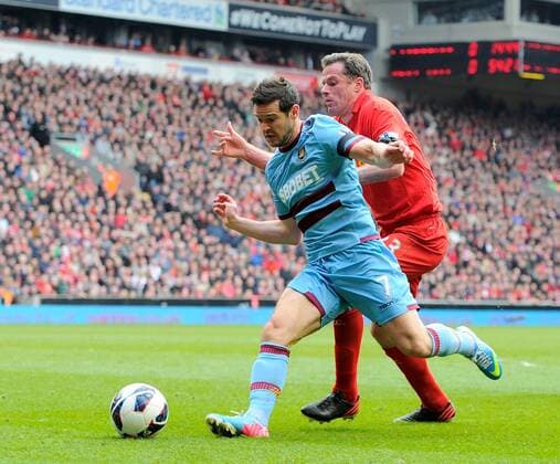 Matthew Jarvis of West Ham United gets past Jamie Carragher of Liverpool - Barclays Premier League - Liverpool FC - West Ham United. Anfield Stadium - Liverpool - England - 07 04 13 - EDITORIAL USE ONLY. No use with unauthorised audio, video, data, fixture lists, club league logos or live services. Online in-match use limited to 120 images, no video emulation. No use in betting, games or single club league player publications.