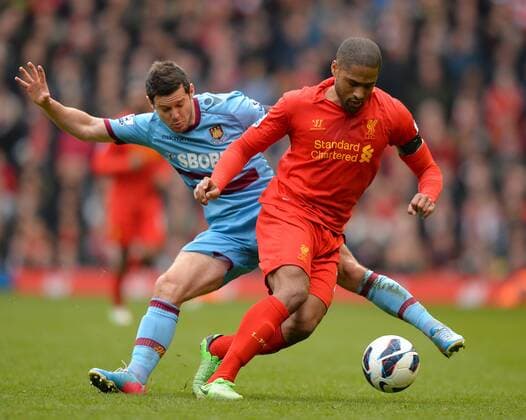 Matthew Jarvis of West Ham United with Glen Johnson of Liverpool - Barclays Premier League - Liverpool FC - West Ham United. Anfield Stadium - Liverpool - England - 07 04 13 - EDITORIAL USE ONLY. No use with unauthorised audio, video, data, fixture lists, club league logos or live services. Online in-match use limited to 120 images, no video emulation. No use in betting, games or single club league player publications.