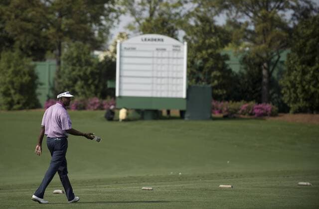 Vijay Singh walks on the practice tee at Augusta National during Masters week on April 7, 2013 in Augusta, Georgia. The 77th Masters Golf Tournament will begin on Thursday.  AUG20130407302
