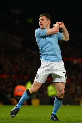 James Milner of Manchester City celebrates scoring with a golf swing - Barclays Premier League - Manchester United (ManU) vs Manchester City - Old Trafford Stadium - Manchester- England - 08 04 13 - Picture Simon Bellis Sportimage EDITORIAL USE ONLY. No use with unauthorised audio, video, data, fixture lists, club league logos or live services. Online in-match use limited to 120 images, no video emulation. No use in betting, games or single club league player publications.