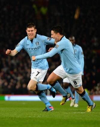 James Milner of Manchester City celebrates scoring - Barclays Premier League - Manchester United (ManU) vs Manchester City - Old Trafford Stadium - Manchester- England - 08 04 13 - Picture Simon Bellis Sportimage EDITORIAL USE ONLY. No use with unauthorised audio, video, data, fixture lists, club league logos or live services. Online in-match use limited to 120 images, no video emulation. No use in betting, games or single club league player publications.