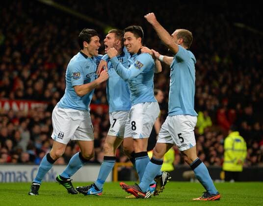James Milner of Manchester City (2l) celebrates his goal - Barclays Premier League - Manchester Utd vs Manchester City - Old Trafford Stadium - Manchester- England - 08 04 13 - Picture Simon Bellis Sportimage EDITORIAL USE ONLY. No use with unauthorised audio, video, data, fixture lists, club league logos or live services. Online in-match use limited to 120 images, no video emulation. No use in betting, games or single club league player publications.