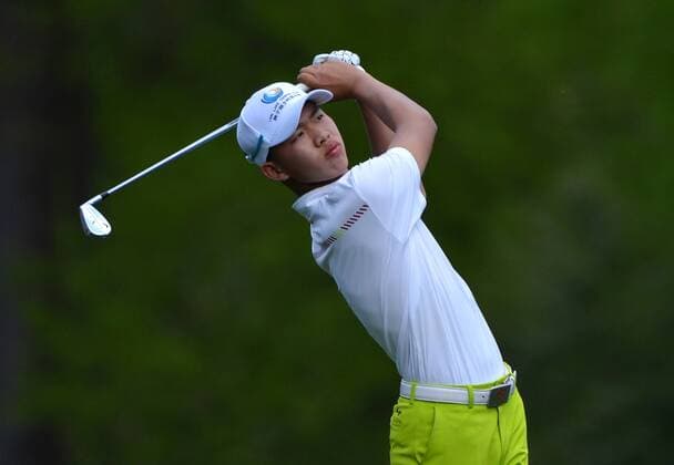 Guan Tianlang of China watches his drive off of the 11th tee box during a practice round before the Master golf tournament at Augusta National Golf Club on April 8, 2013 in Augusta, Georgia.  AUG20130408353