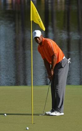 Tiger Woods putts on the 16th green during a practice round before the Master golf tournament at Augusta National Golf Club on April 8, 2013 in Augusta, Georgia.  AUG20130408328