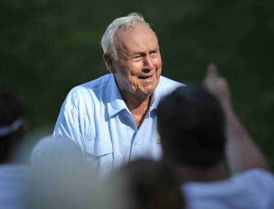 Arnold Palmer acknowledges the crowd as he walks to the 9th green during the Masters Par 3 Contest, a day before the beginning of the Masters tournament, at Augusta National, on April 10, 2013 in Augusta, Georgia.  AUG20130410345