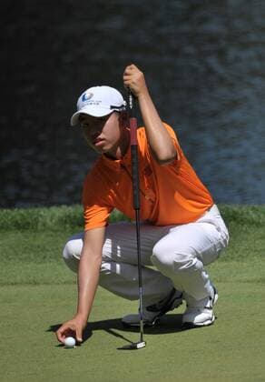 Guan Tianlang of China lines up a putt on the 9th green during the Masters Par 3 Contest, a day before the beginning of the Masters tournament, at Augusta National, on April 10, 2013 in Augusta, Georgia.  AUG20130410346
